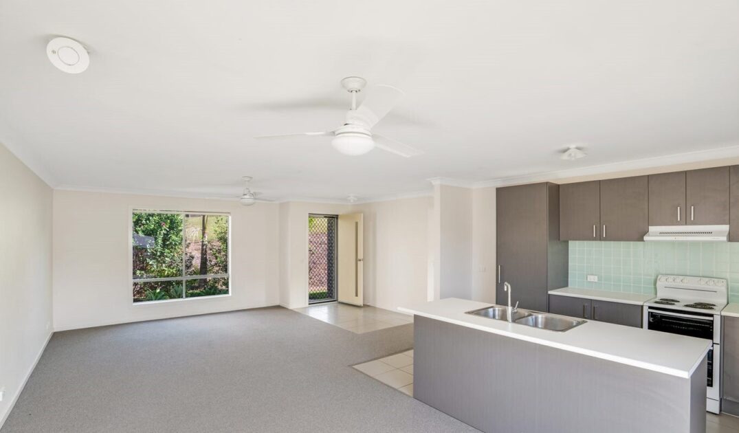 Entry way with kitchen and living