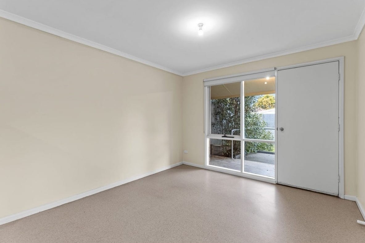Accessible dining/multi-use room in Accessible unit in quiet Huntfield Heights, 2/11 Lorne Crescent, featuring sliding door to garden and clear circulation, part of Australia’s leading disability accommodation provider.