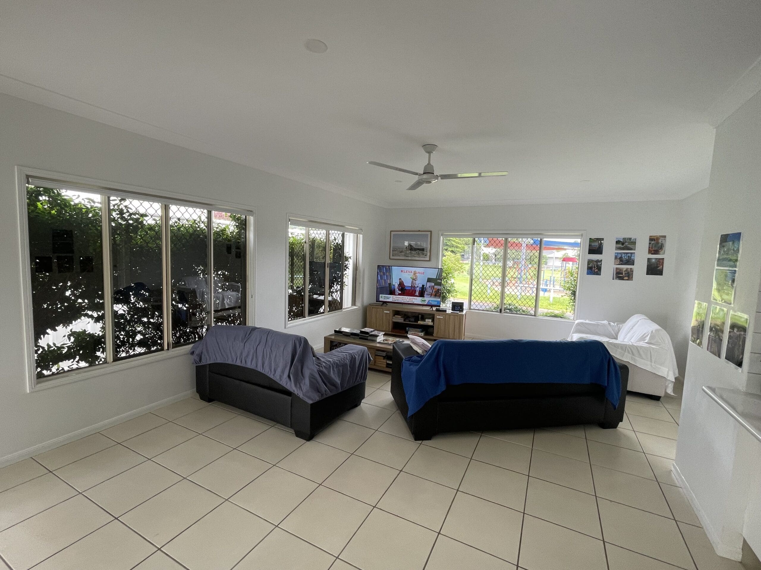 Living room in Spacious SIL home in leafy 23 Norfolk Circuit, Redlynch featuring accessible seating, large windows, and personalised decor, part of Australia’s leading disability accommodation provider.