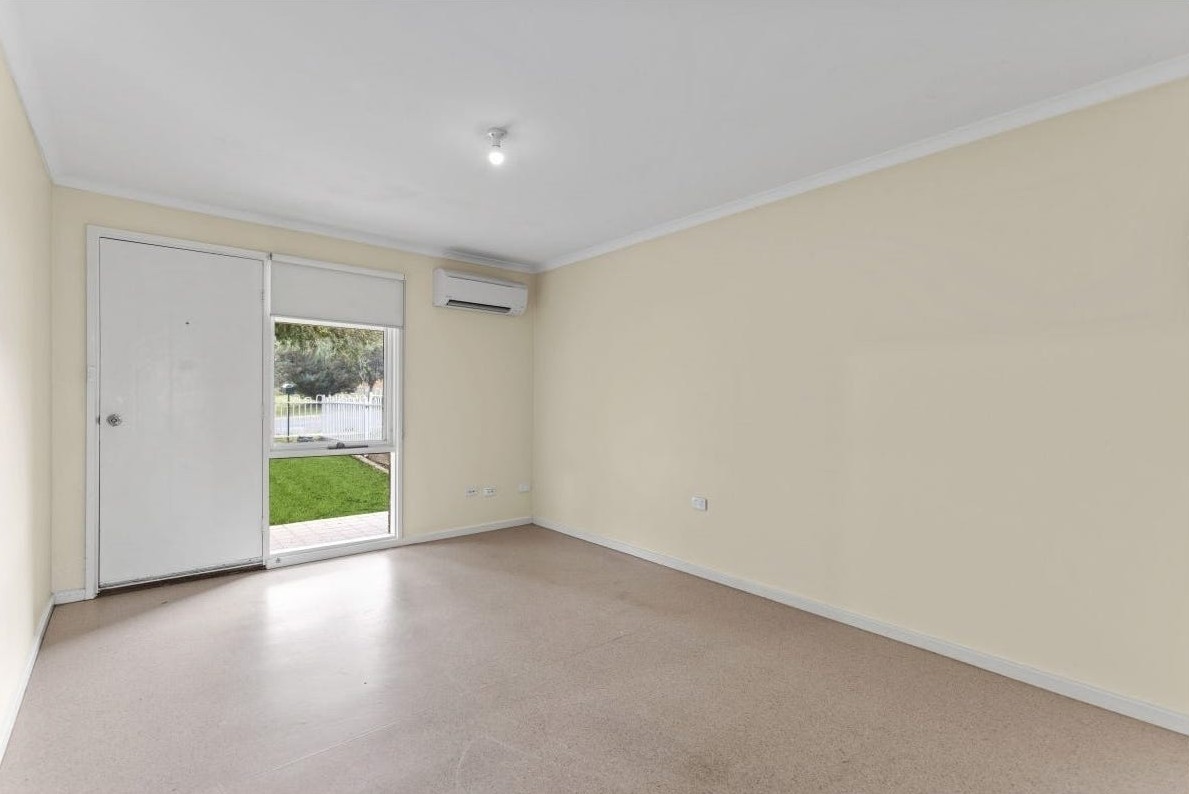 Light-filled separate living area in Accessible unit in quiet Huntfield Heights, 2/11 Lorne Crescent, featuring garden access, neutral tones, and clear circulation, part of Australia’s leading disability accommodation provider.