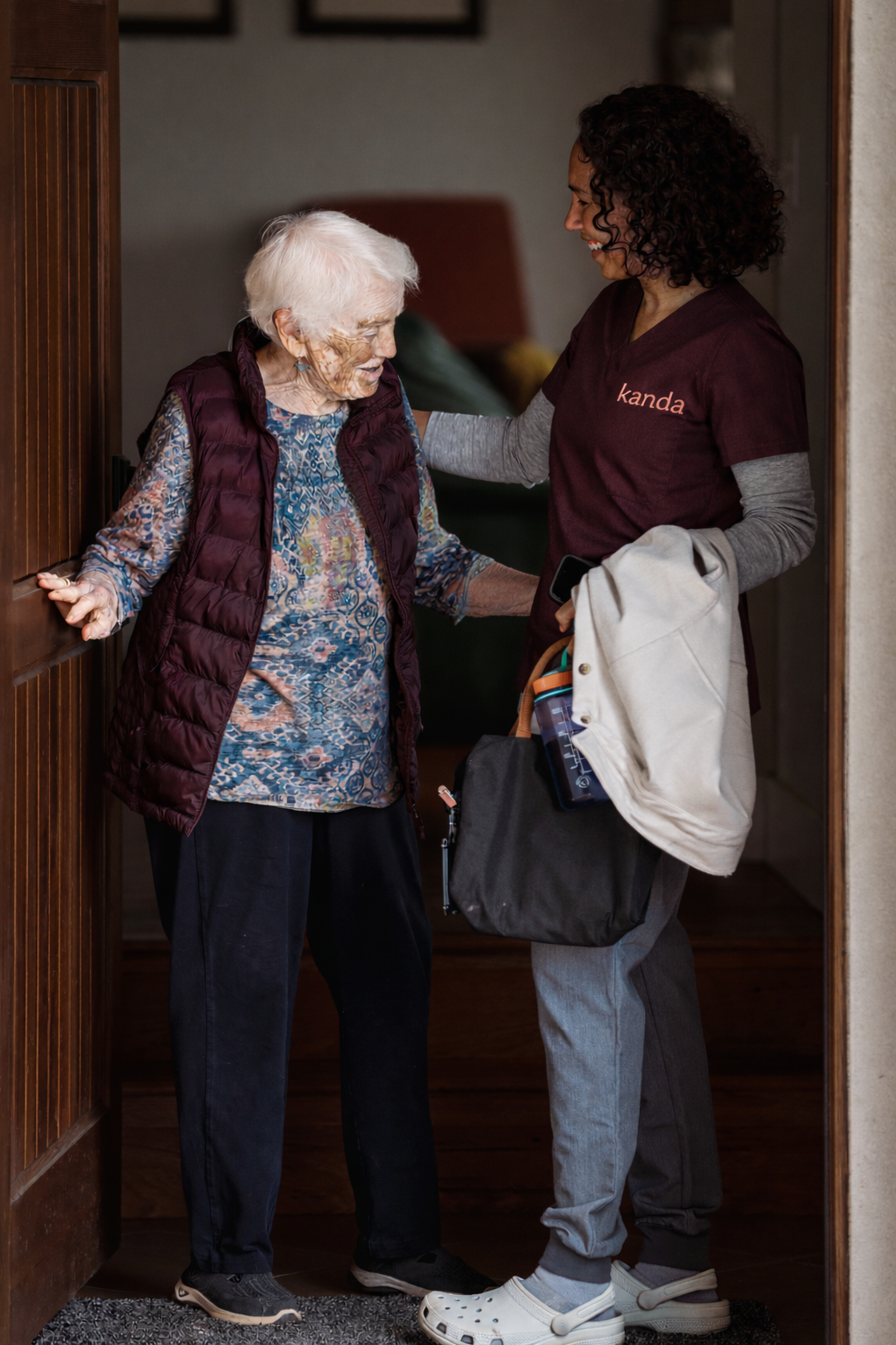 Kanda home care support team meet and greet elder client at doorway