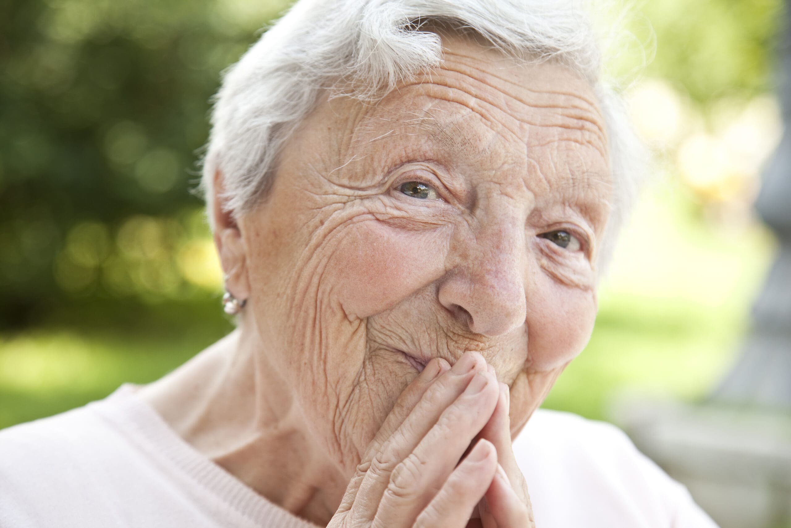 Joyful senior looking at the camera smiling