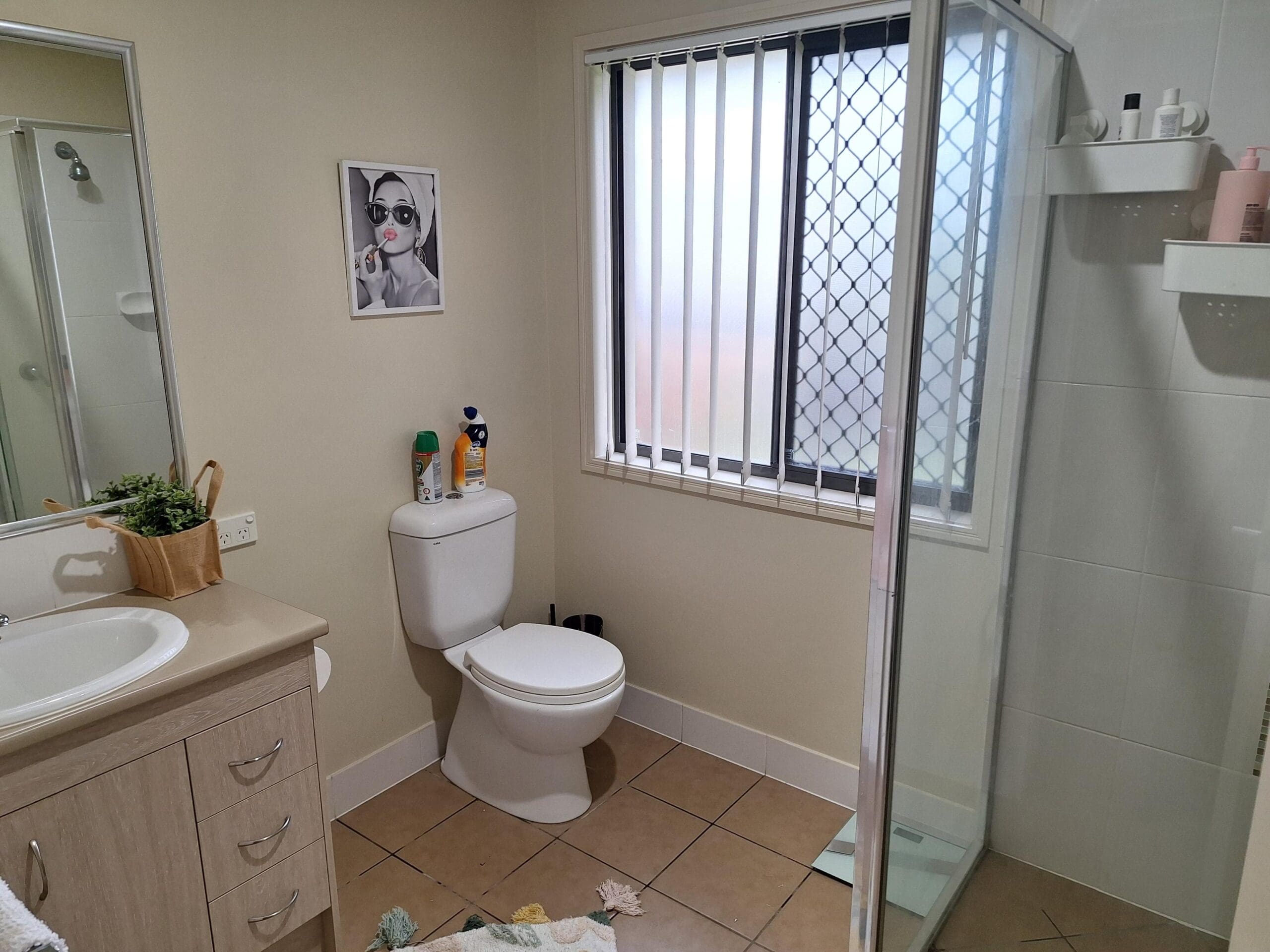 Bathroom in welcoming and cosy SIL in Brassall, Ipswich, featuring step-free shower, grab rails, and natural light, part of Australia’s leading disability accommodation provider.