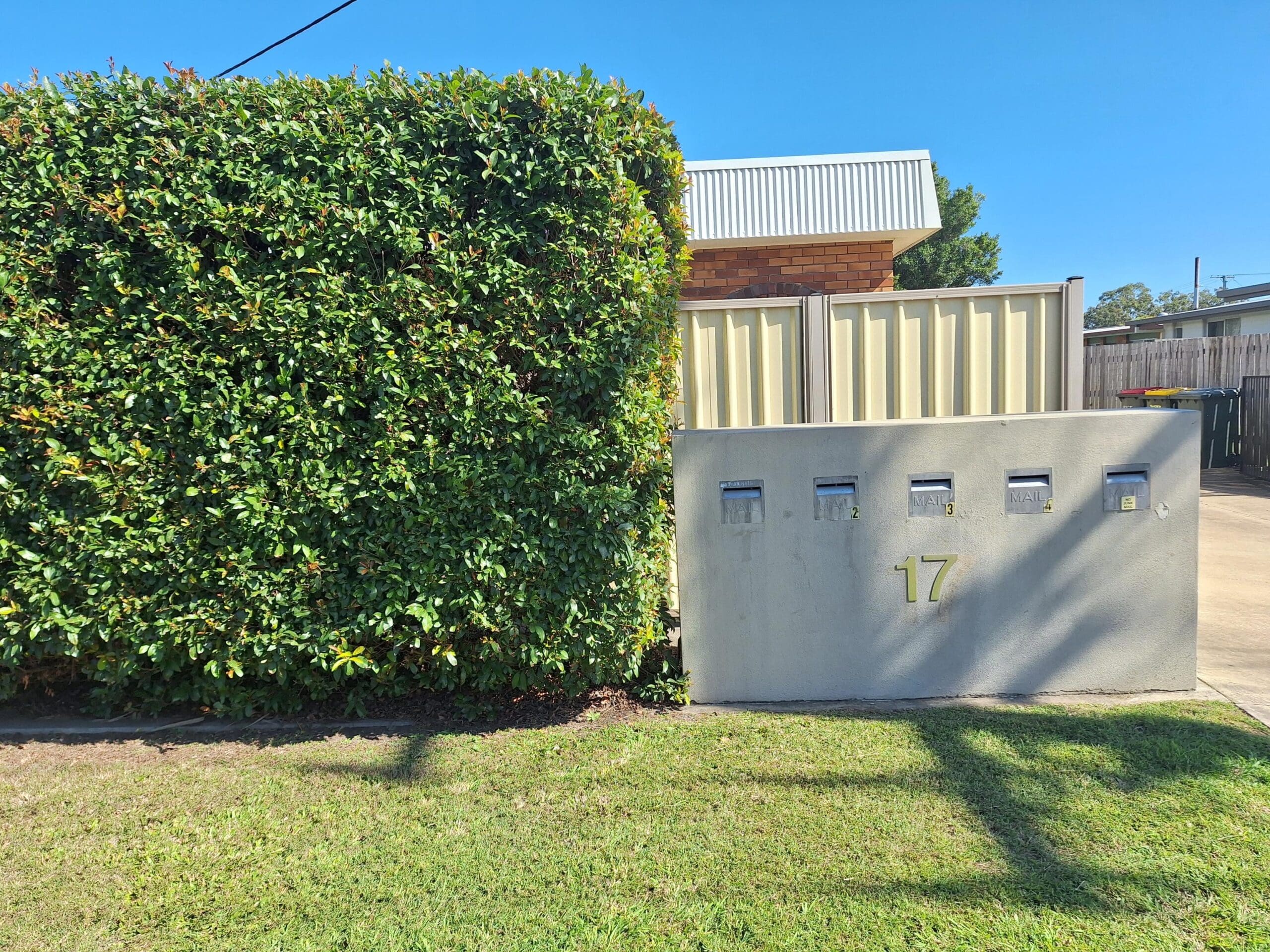 Private SIL unit living in a prime Millbank location with front hedge, mailboxes and street number 17 by Australia's leading disability accommodation provider.