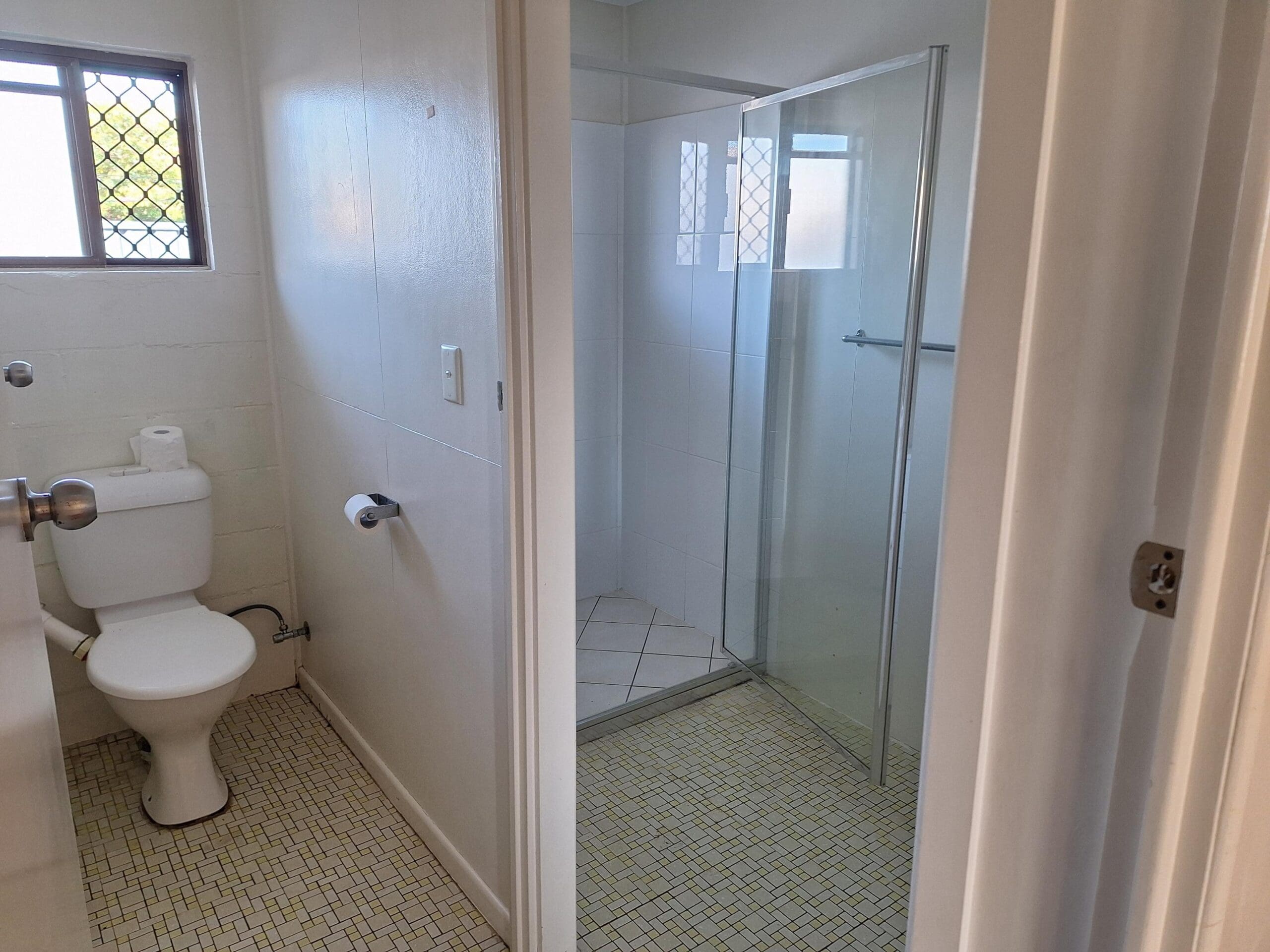 Private SIL unit living in a prime Millbank location with bathroom toilet, tiled flooring and glass shower screen by Australia's leading disability accommodation provider.