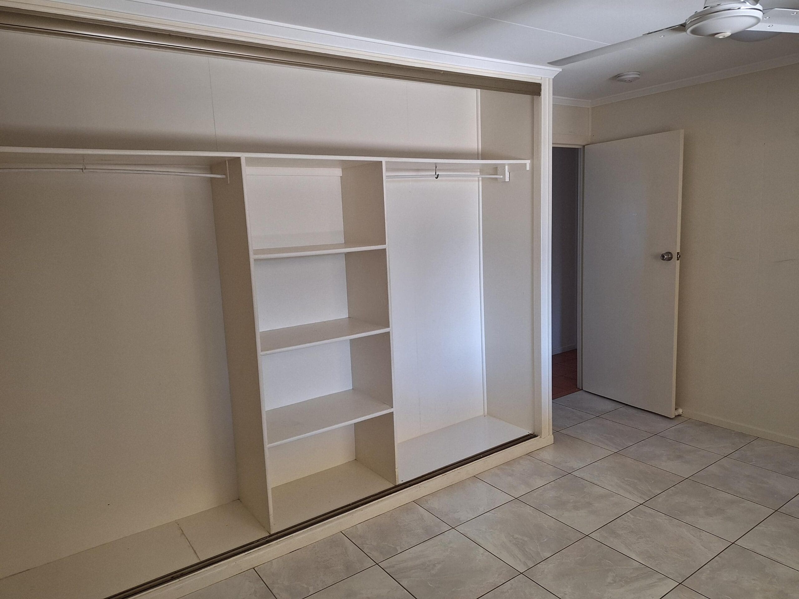 Private SIL unit living in a prime Millbank location with built-in bedroom wardrobe, tiled flooring and ceiling fan by Australia's leading disability accommodation provider.