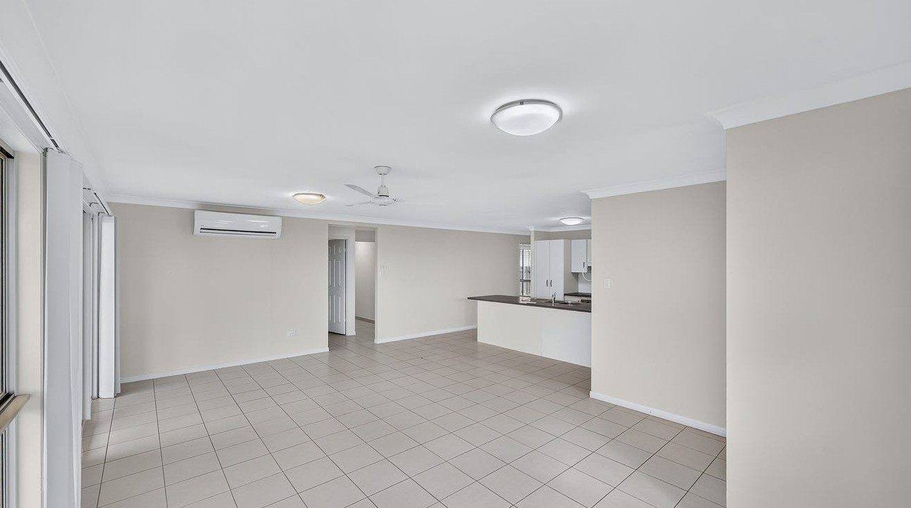 Roomy SIL home in Gracemere, Joseph St Gracemere with spacious tiled living area, air conditioning, ceiling fans and open kitchen by Australia's leading disability accommodation provider.