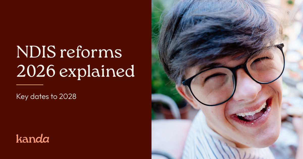 Person with short dark hair and round glasses laughing outdoors, beside the text “NDIS reforms 2026 explained: key dates to 2028”, with the Kanda logo.